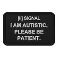 Black rectangular SIGNAL patch with white embroidered I AM AUTISTIC. PLEASE BE PATIENT.; digital mockup of earlier artwork.