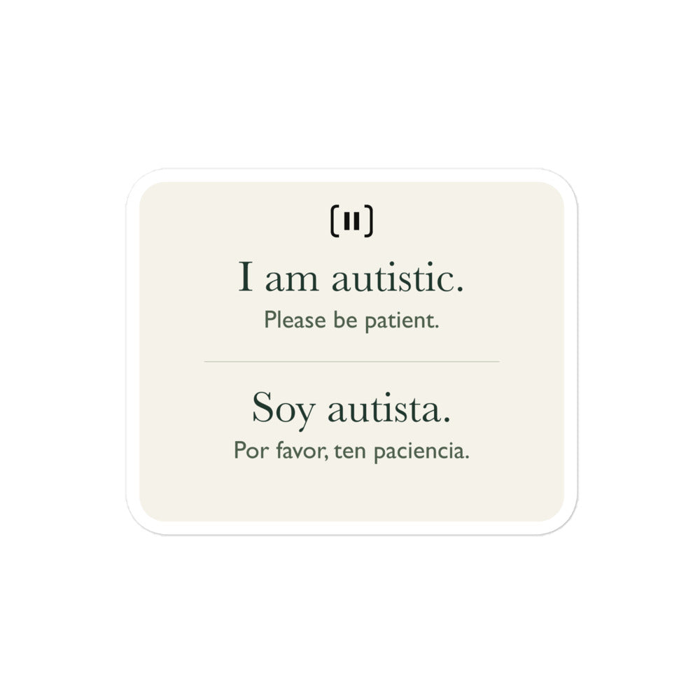 Supplier mockup of a cream SIGNAL sticker with a rounded pause mark: “I am autistic. Please be patient.” above “Soy autista. Por favor, ten paciencia.”