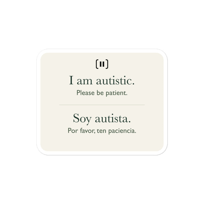 Supplier mockup of a cream SIGNAL sticker with a rounded pause mark: “I am autistic. Please be patient.” above “Soy autista. Por favor, ten paciencia.”