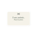 Supplier mockup of a cream SIGNAL sticker with a rounded pause mark and green text: “I am autistic. Please be patient.”