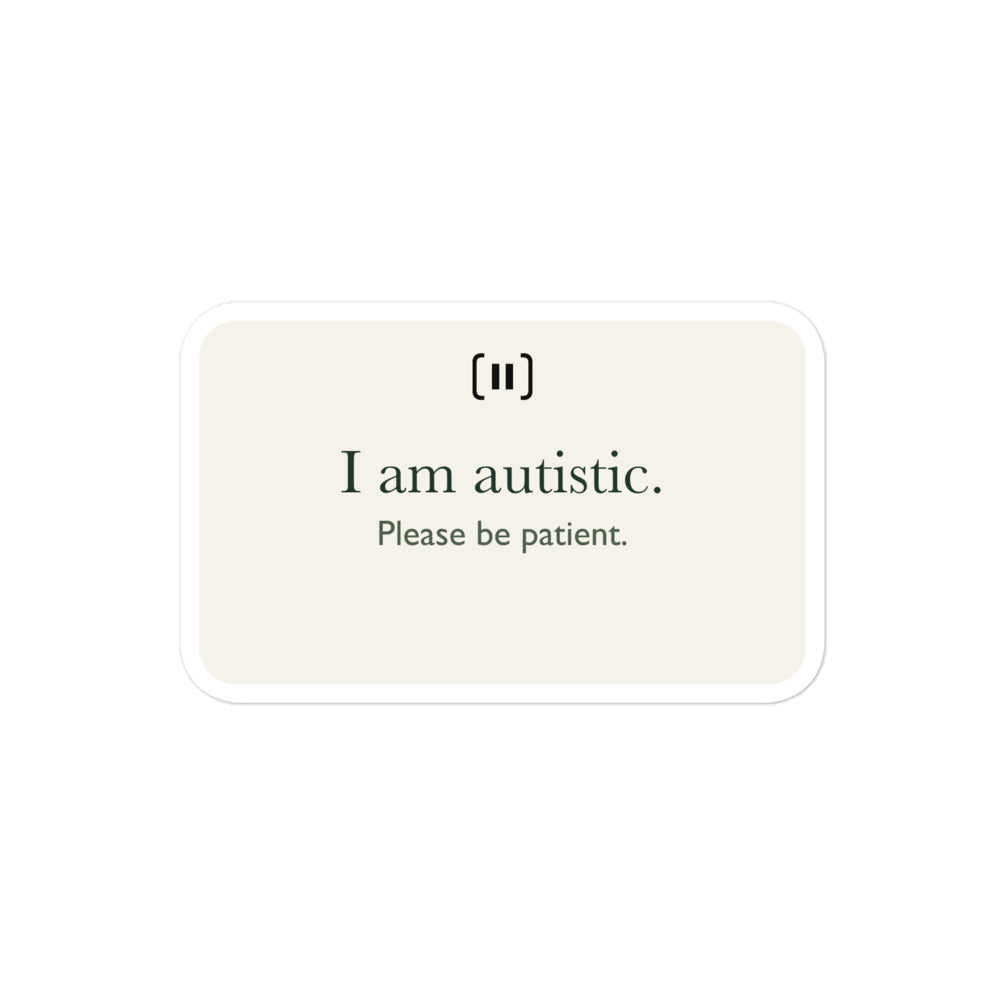 Supplier mockup of a cream SIGNAL sticker with a rounded pause mark and green text: “I am autistic. Please be patient.”