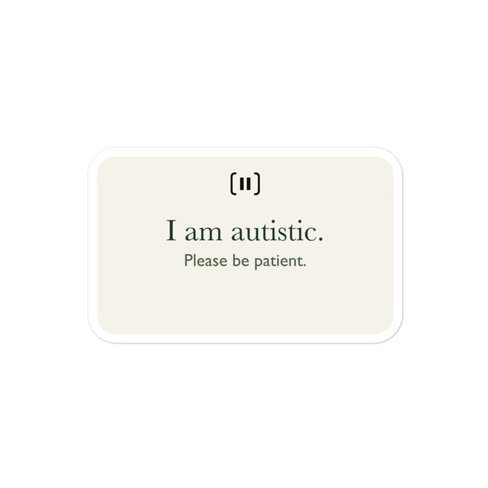 Supplier mockup of a cream SIGNAL sticker with a rounded pause mark and green text: “I am autistic. Please be patient.”