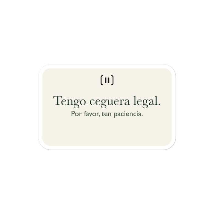 Maqueta del proveedor de una pegatina SIGNAL crema, con la marca de pausa redondeada y el texto «Tengo ceguera legal. Por favor, ten paciencia» en verde.