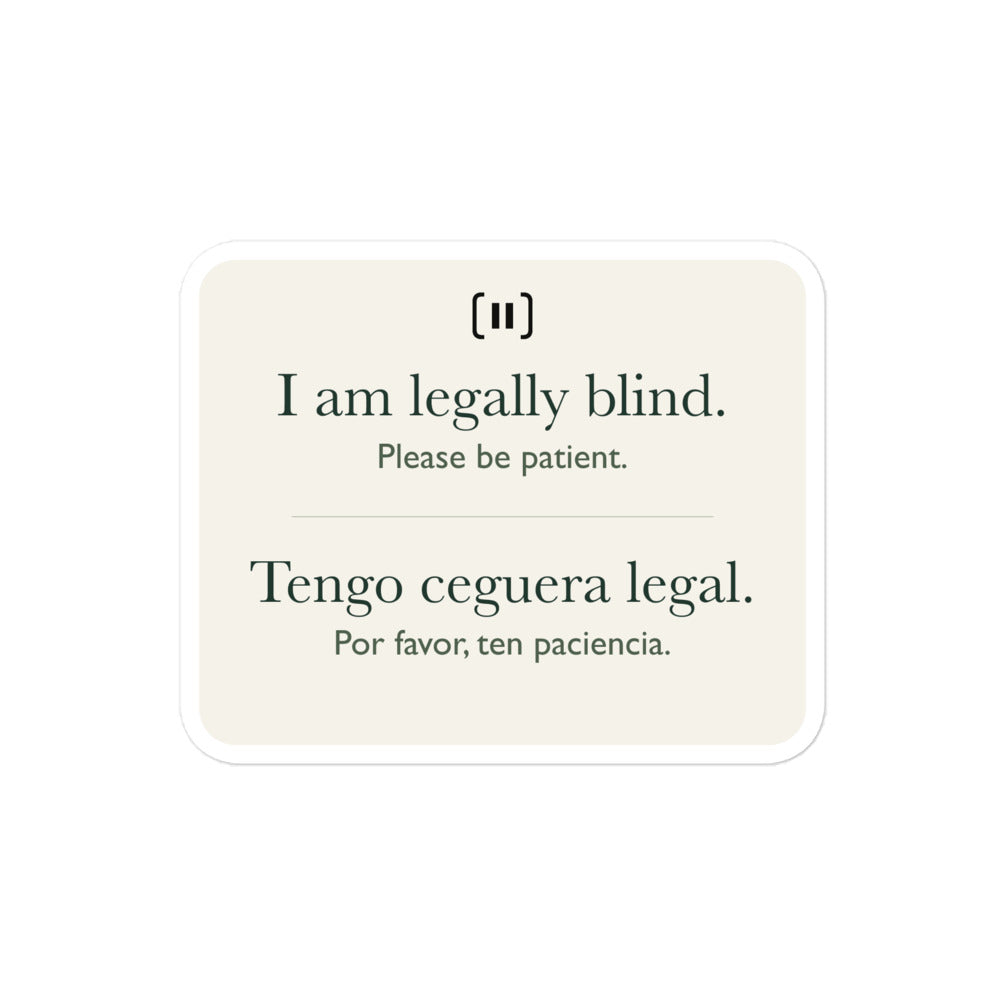 Supplier mockup of a cream SIGNAL sticker with a rounded pause mark: “I am legally blind. Please be patient.” above “Tengo ceguera legal. Por favor, ten paciencia.”