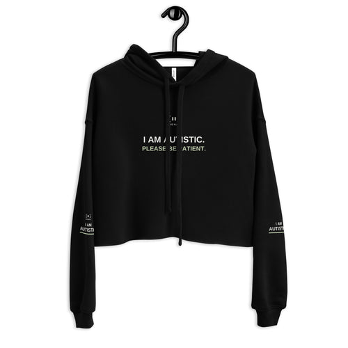Black women’s cropped SIGNAL hoodie, front with drawstrings crossing the autism message; digital mockup of earlier artwork.